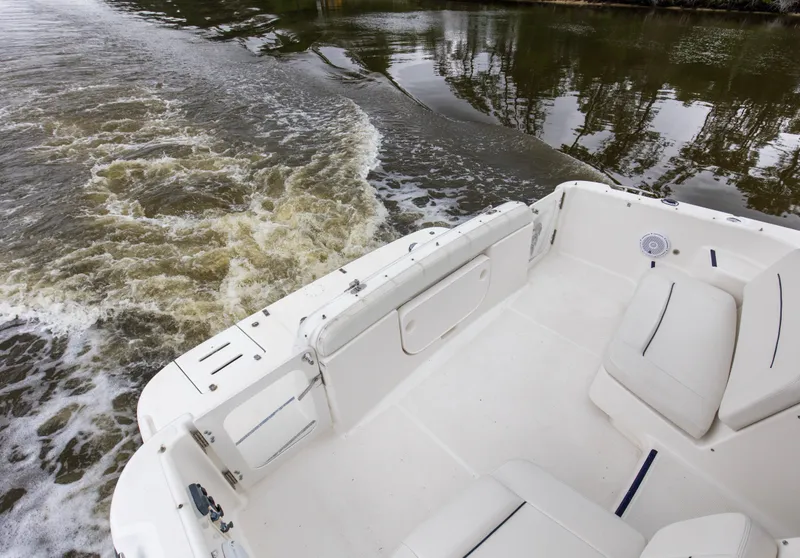 Slide: The Image of 2005 Tiara Yachts 3600 Sovran cruising on calm waters, view of spacious deck. - 23