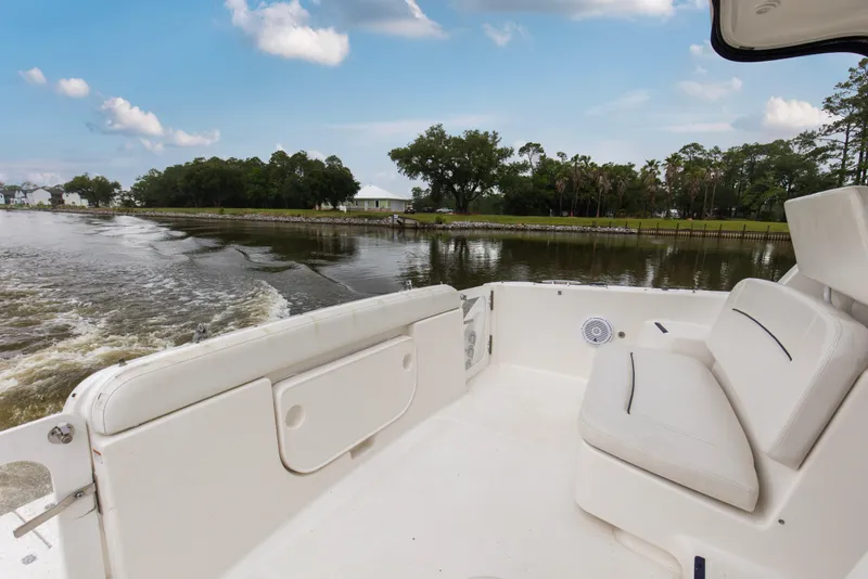 Slide: The Image of 2005 Tiara Yachts 3600 Sovran cruising on a scenic river with lush greenery. - 24