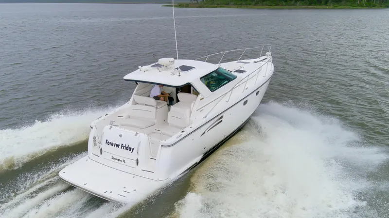 Slide: The Image of 2005 Tiara Yachts 3600 Sovran cruising on open water, rear view. - 36