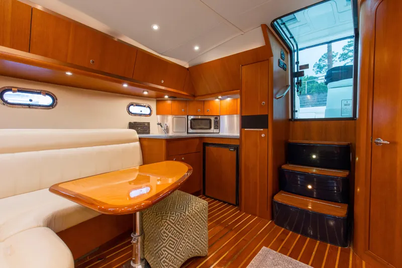 Slide: The Image of Interior of 2005 Tiara Yachts 3600 Sovran with wood finish and modern amenities. - 9