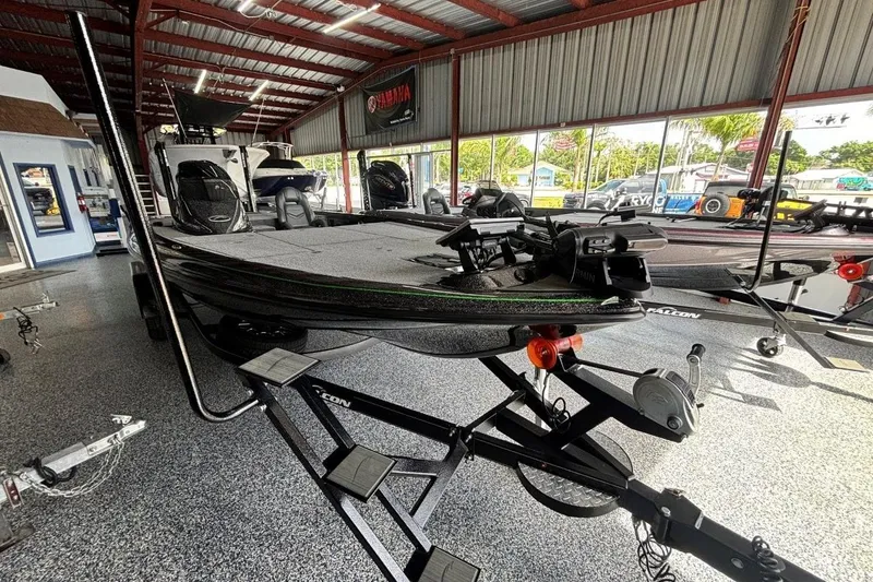 Slide: The Image of 2025 Falcon Boats 21 Predator on display in a showroom. - 15