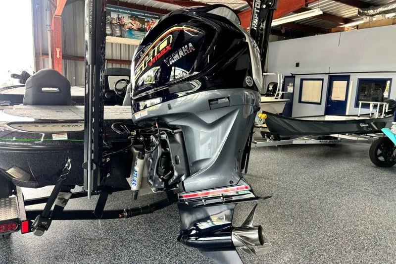 Slide: The Image of 2025 Falcon Boats 21 Predator with Yamaha VMAX engine in showroom. - 16