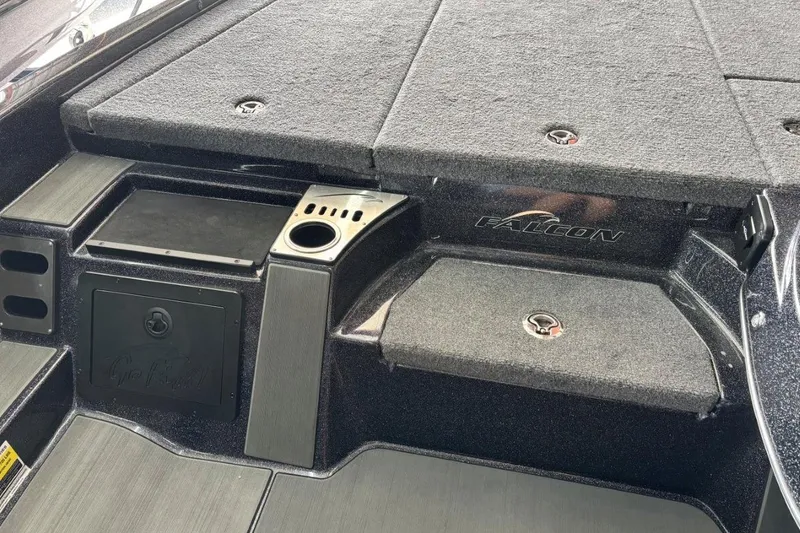 Slide: The Image of 2025 Falcon Boats 21 Predator interior with storage compartments and cup holder. - 23