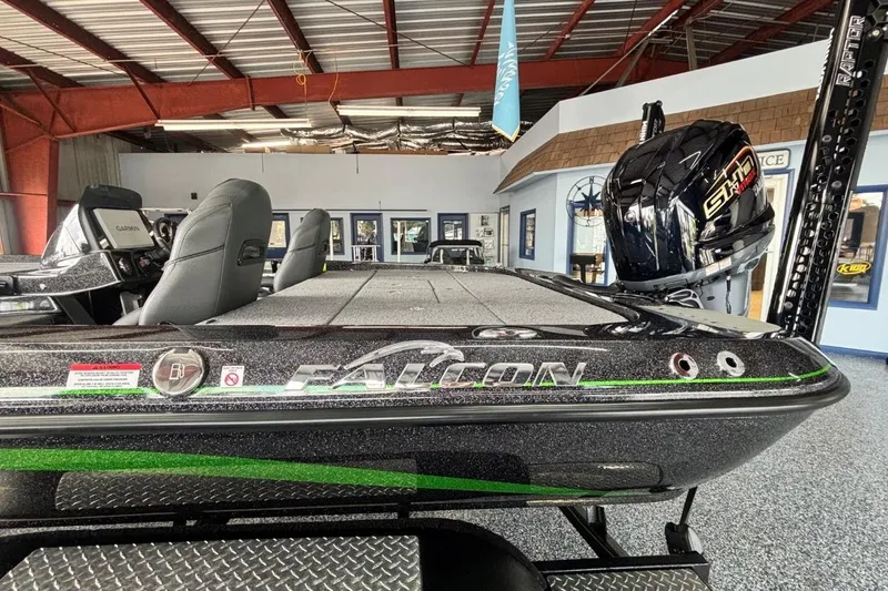 Slide: The Image of 2025 Falcon Boats 21 Predator in showroom, featuring sleek design and powerful engine. - 6