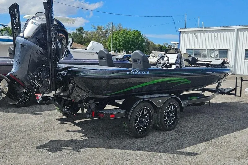 Slide: The Image of 2025 Falcon Boats 21 Predator on trailer, featuring sleek design and powerful engine. - 7