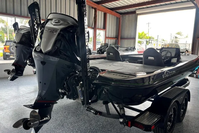 Slide: The Image of 2025 Falcon Boats 21 Predator in a showroom, featuring dual outboard motors. - 8