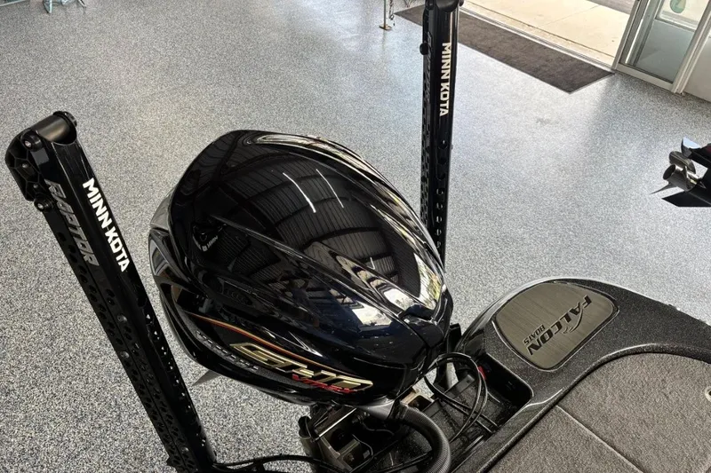 Slide: The Image of 2025 Falcon Boats 21 Predator with Minn Kota Raptor anchors in showroom. - 9