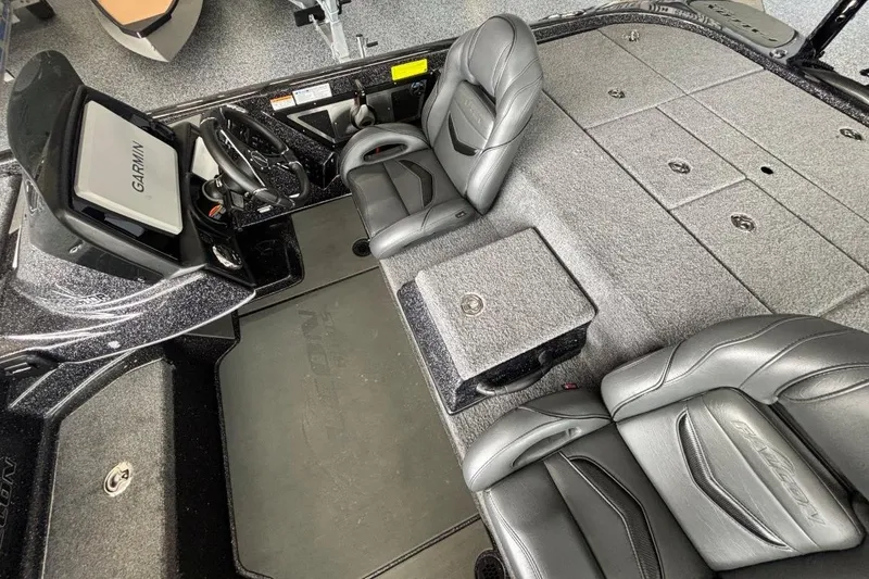 Slide: The Image of Interior of 2025 Falcon Boats 21 Predator, featuring sleek seating and Garmin navigation system. - 19