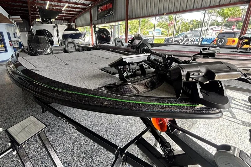 Slide: The Image of 2025 Falcon Boats 21 Predator in showroom, featuring advanced navigation equipment. - 4