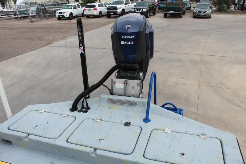 Slide: The Image of 2015 Shoalwater 23 Catamaran with Evinrude 250 engine in a parking lot. - 12