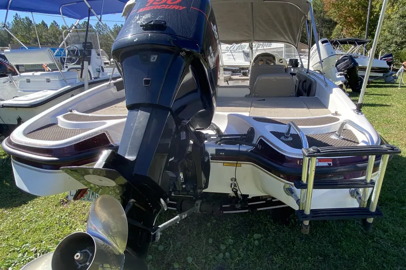 Slide: The Image of 2001 ProCraft 180 Combo boat with Mercury outboard engine, parked on grass. - 15