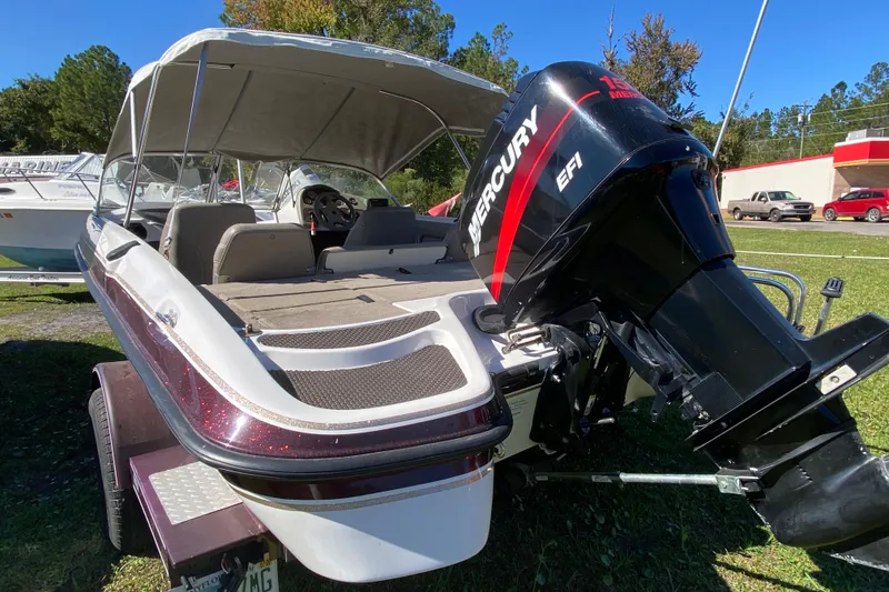 Slide: The Image of 2001 ProCraft 180 Combo boat with Mercury EFI engine, parked on a trailer. - 4