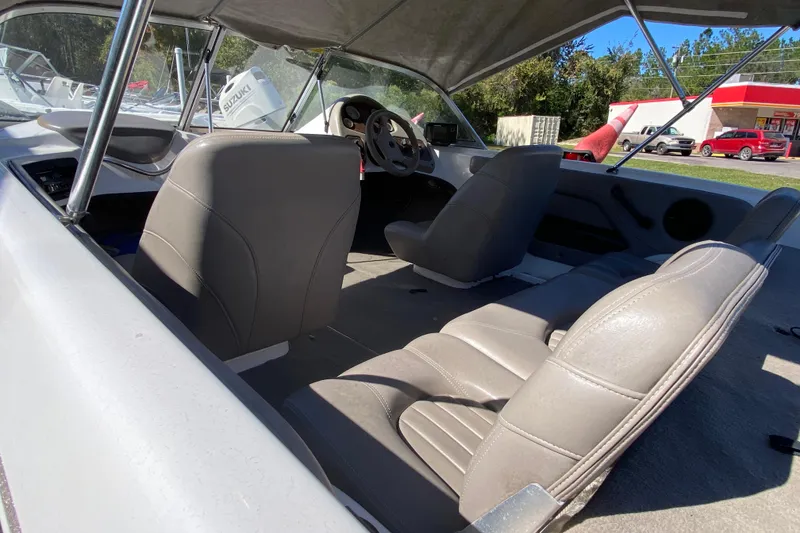 Slide: The Image of Interior of 2001 ProCraft 180 Combo boat with gray seating and steering wheel. - 6