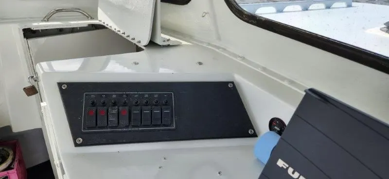 Slide: The Image of Control panel of a 1990 South Shore 30 Downeast boat interior. - 12