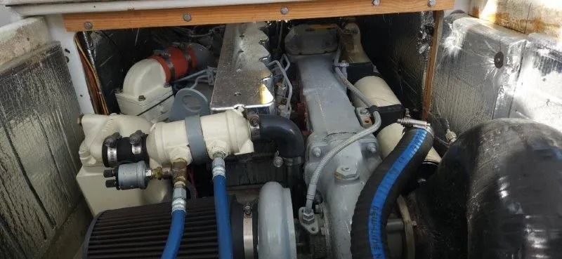 Slide: The Image of Engine compartment of a 1990 South Shore 30 Downeast boat, showcasing mechanical components. - 19