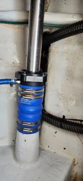 Slide: The Image of Close-up of a 1990 South Shore 30 Downeast boat's shaft seal with blue hose clamps. - 20