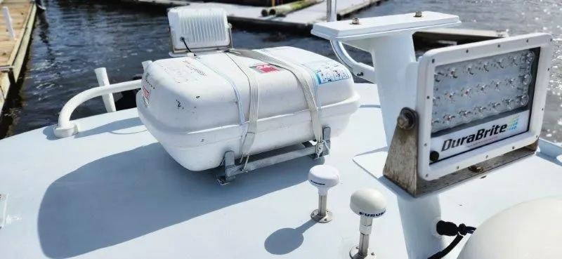 Slide: The Image of 1990 South Shore 30 Downeast boat deck with DuraBrite light and safety equipment. - 7