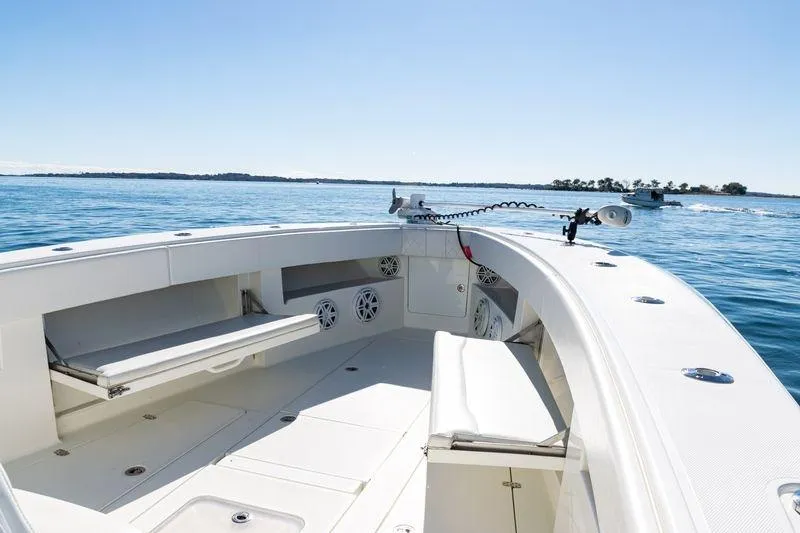 Slide: The Image of 2016 SeaVee 390Z boat interior with seating, on calm blue water. - 17