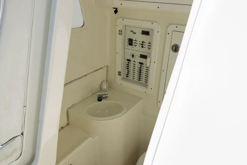 Slide: The Image of 2016 SeaVee 390Z boat interior with control panel and sink. - 23