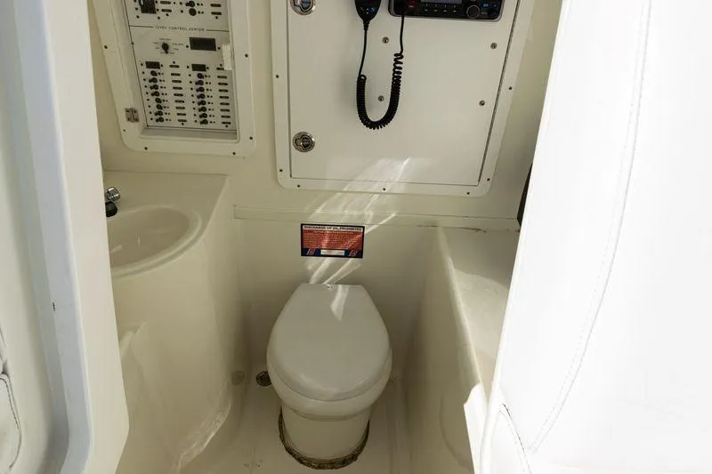 Slide: The Image of 2016 SeaVee 390Z boat interior with toilet and control panel. - 24