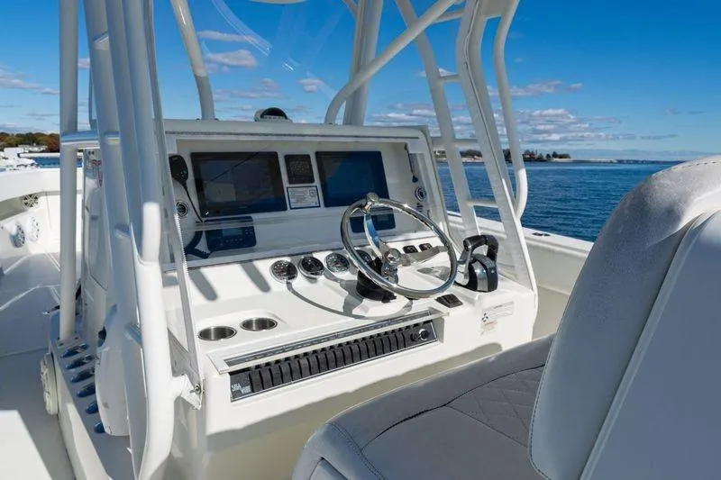 Slide: The Image of 2016 SeaVee 390Z boat helm with modern controls and ocean view. - 25