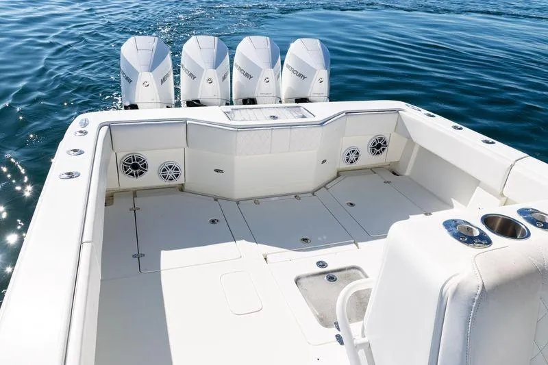Slide: The Image of 2016 SeaVee 390Z boat with four Mercury engines on calm water. - 35