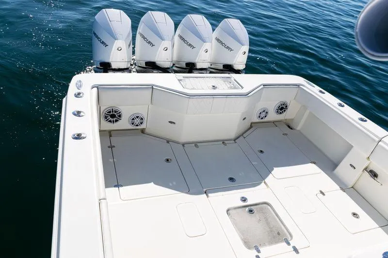 Slide: The Image of 2016 SeaVee 390Z boat with four Mercury outboard engines on open water. - 37
