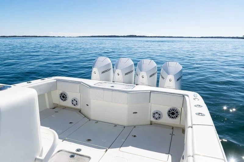 Slide: The Image of 2016 SeaVee 390Z boat with four Mercury engines on calm water. - 39