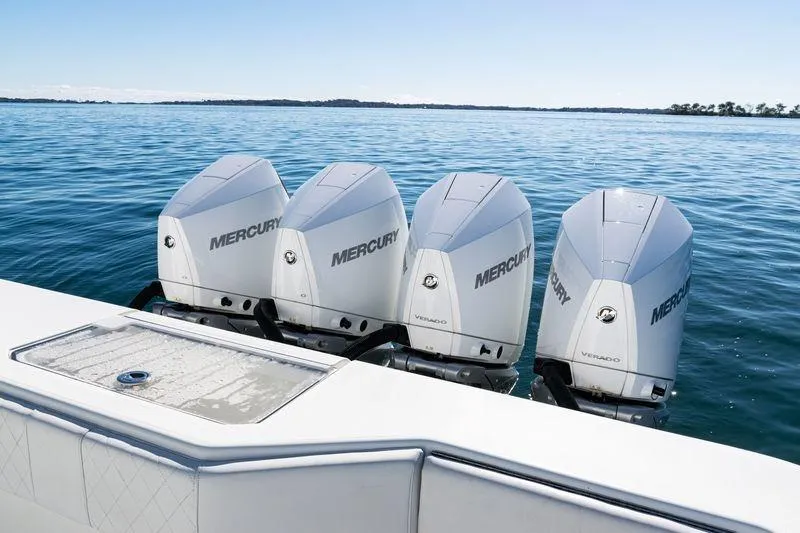 Slide: The Image of Four Mercury outboard engines on a 2016 SeaVee 390Z boat in open water. - 42