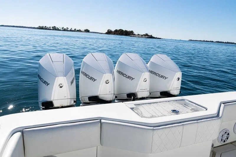 Slide: The Image of 2016 SeaVee 390Z boat with four Mercury outboard engines on calm water. - 43