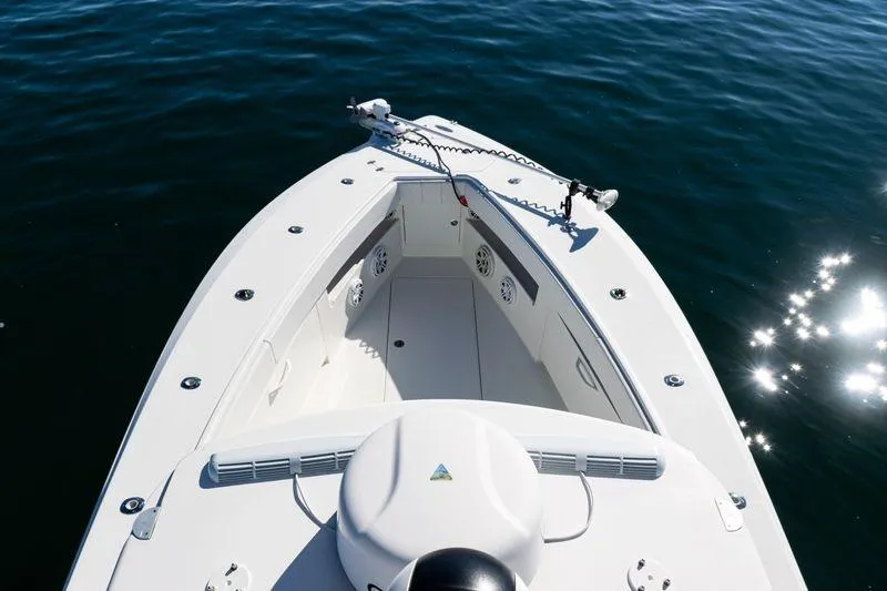Slide: The Image of 2016 SeaVee 390Z boat bow on calm water, showcasing sleek design and spacious deck. - 48