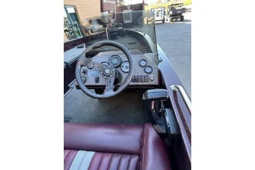 Slide: The Image of 1995 Ranger 372V boat dashboard with steering wheel and gauges. - 4