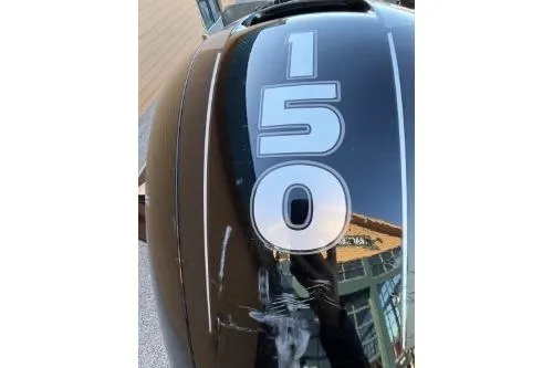 Slide: The Image of Close-up of 1995 Ranger 372V boat engine with '150' decal. - 5