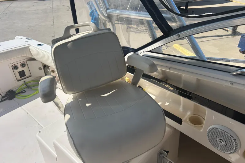 Slide: The Image of 2004 Grady-White Marlin 300 boat interior with helm seat and dashboard controls. - 14