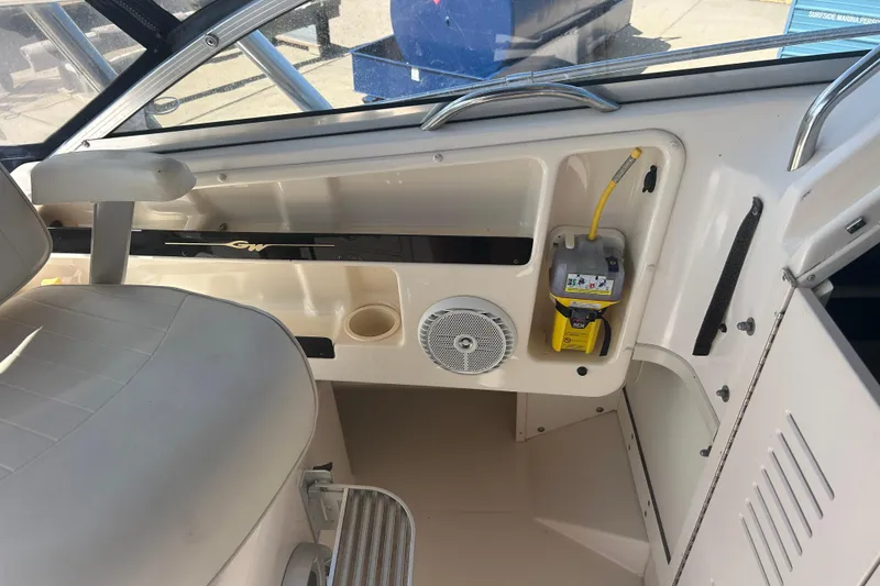 Slide: The Image of 2004 Grady-White Marlin 300 boat interior with seating and control panel. - 15