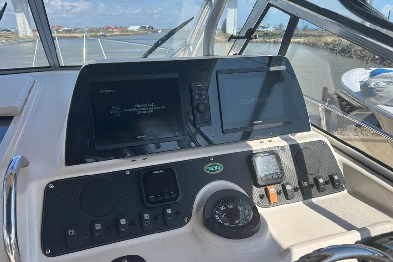 Slide: The Image of Dashboard of 2004 Grady-White Marlin 300 boat with Garmin navigation system. - 16