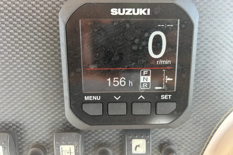 Slide: The Image of Suzuki display on 2004 Grady-White Marlin 300 boat showing 156 hours. - 17