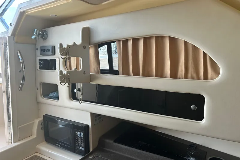 Slide: The Image of Interior of 2004 Grady-White Marlin 300 boat with microwave and audio system. - 25