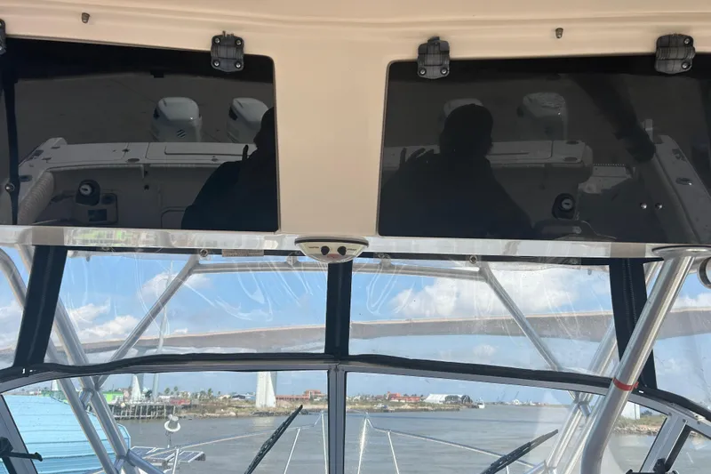Slide: The Image of 2004 Grady-White Marlin 300 boat interior with ocean view through windshield. - 27