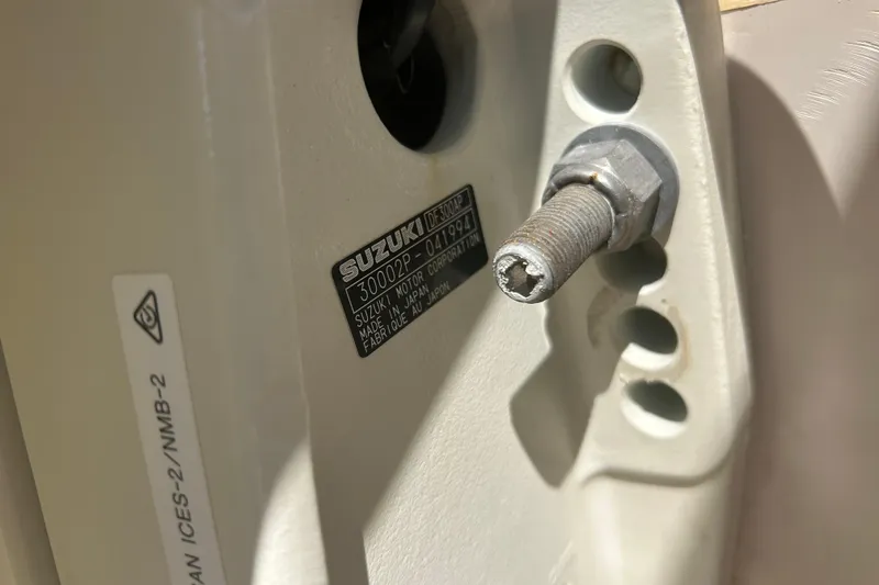 Slide: The Image of Close-up of a Suzuki motor part on a 2004 Grady-White Marlin 300 boat. - 38