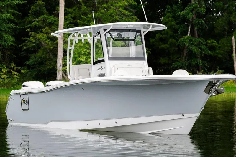 Slide: The Image of Manufacturer Provided Image: 2025 Sea Hunt Gamefish 30 boat with forward seating on calm water. - 2
