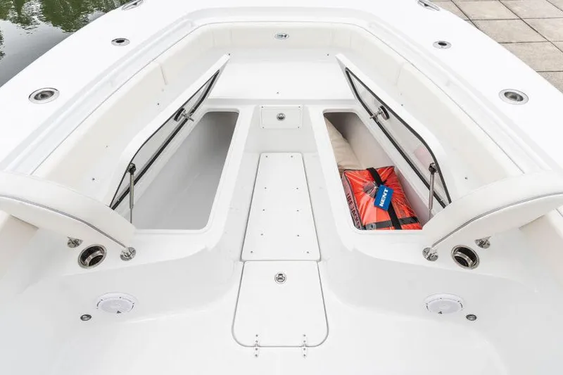 Slide: The Image of Manufacturer Provided Image: 2025 Sea Hunt Gamefish 30 Forward Seating with open storage compartments and safety equipment. - 6