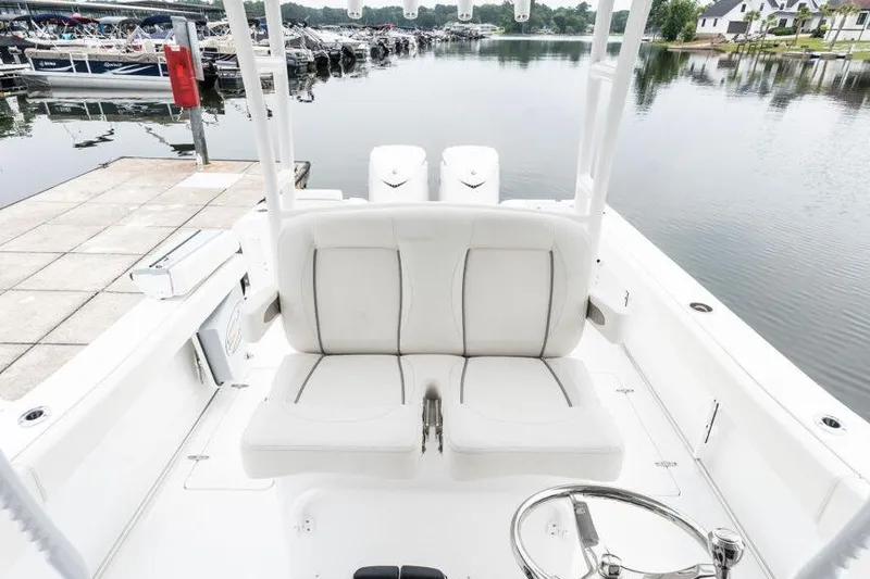 Slide: The Image of Manufacturer Provided Image: 2025 Sea Hunt Gamefish 30 boat with forward seating at a marina dock. - 9