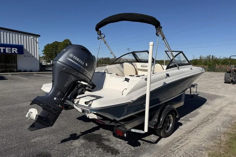 Slide: The Image of 2024 Stingray 191 DC boat with outboard motor at marine service center. - 7