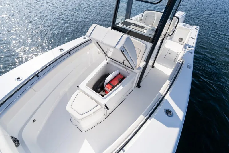 Slide: The Image of Manufacturer Provided Image: 2026 Sea Hunt Gamefish 27 Coffin Box boat on water, open storage compartment visible. - 4