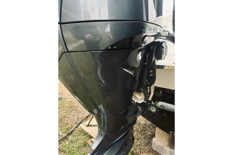 Slide: The Image of 2022 Robalo R272 Center Console boat engine close-up, showcasing sleek design and mechanics. - 18