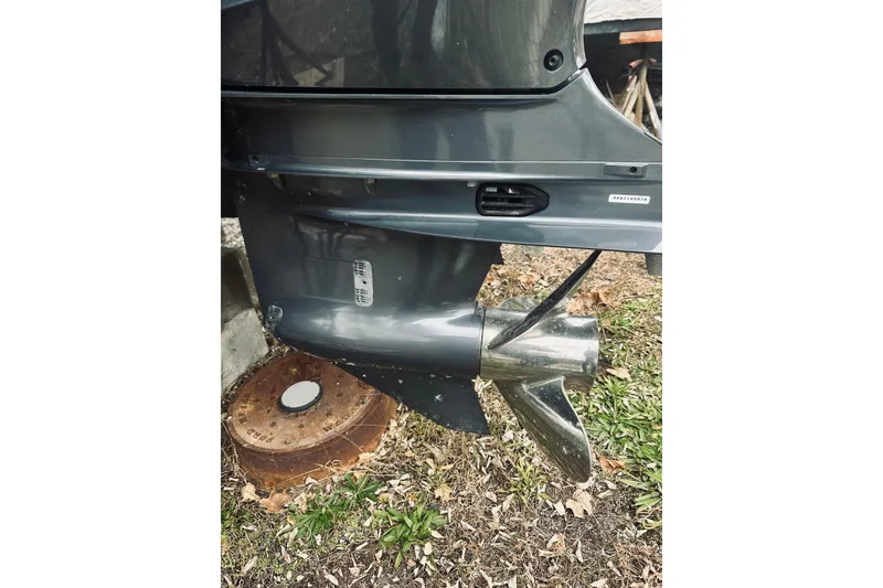 Slide: The Image of 2022 Robalo R272 Center Console boat propeller and lower unit detail. - 21