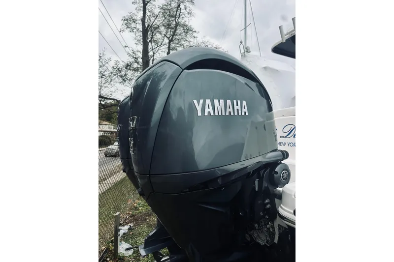 Slide: The Image of Yamaha outboard motor on 2022 Robalo R272 Center Console boat, outdoor setting. - 22