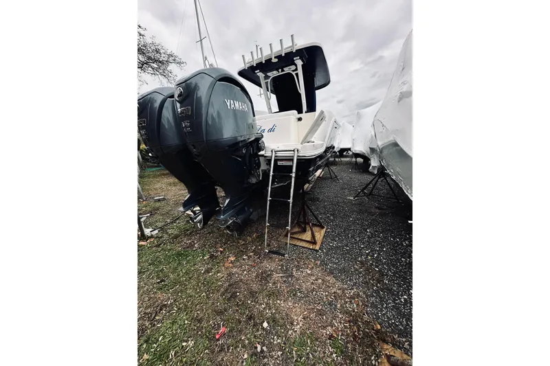 Slide: The Image of 2022 Robalo R272 Center Console boat with twin Yamaha engines on display. - 33