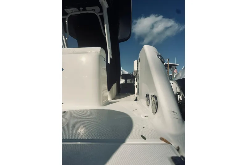 Slide: The Image of 2022 Robalo R272 Center Console boat deck with clear sky background. - 35